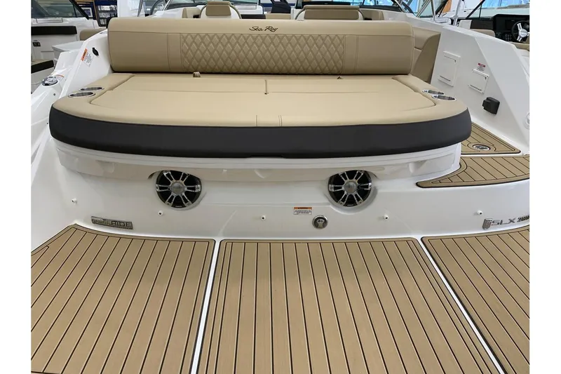 Slide: The Image of 2020 Sea Ray 280 SLX boat with tan seating and teak-style flooring. - 6