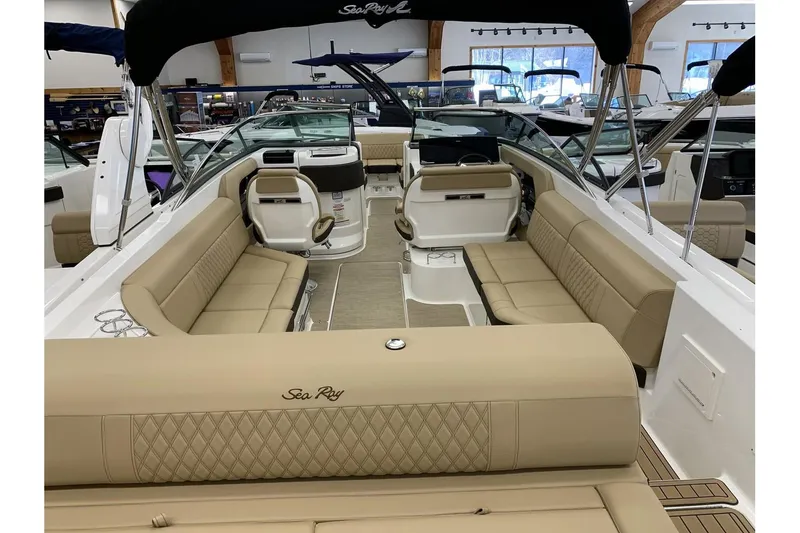Slide: The Image of 2020 Sea Ray 280 SLX boat interior with beige seating and modern design. - 9
