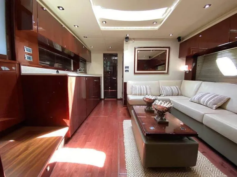 Slide: The Image of Luxurious interior of 2010 Sea Ray 540 Sundancer yacht with elegant furnishings and wood finishes. - 13