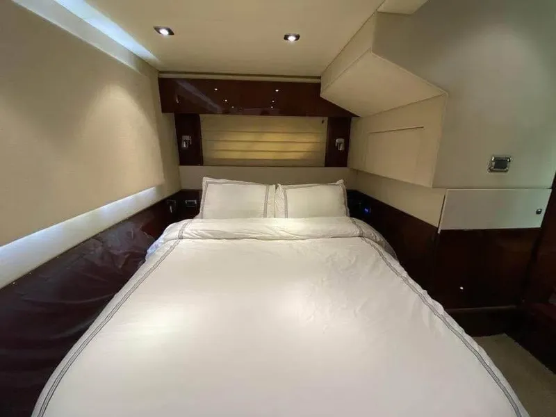 Slide: The Image of Luxurious bedroom interior of 2010 Sea Ray 540 Sundancer yacht with elegant bedding. - 15