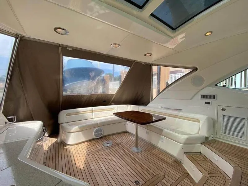 Slide: The Image of Luxurious interior of 2010 Sea Ray 540 Sundancer yacht with seating and wooden flooring. - 5