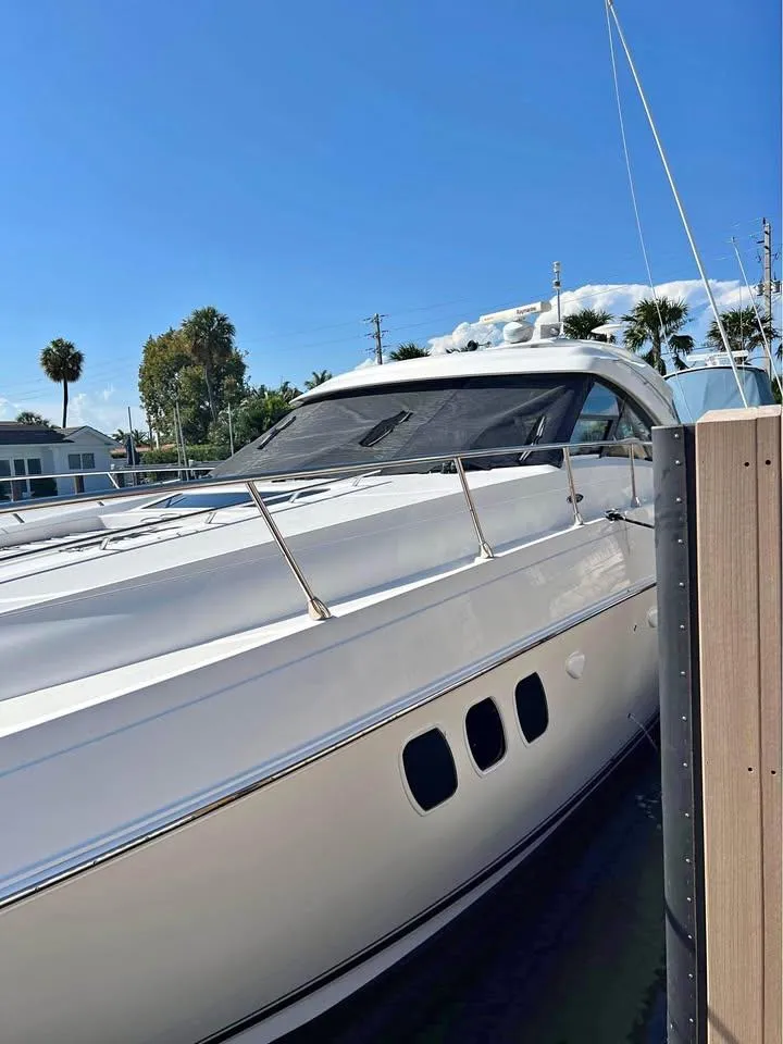 Slide: The Image of 2010 Sea Ray 540 Sundancer yacht docked under clear blue sky. - 7