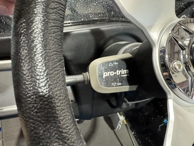Slide: The Image of Steering wheel with Pro-Trim control on a 2022 Nitro Z19 Pro boat. - 10
