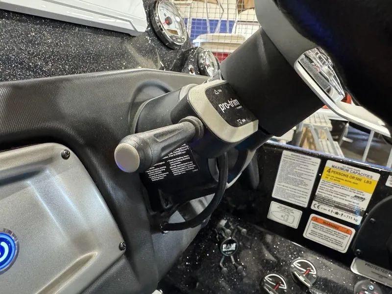 Slide: The Image of Steering console of 2022 Nitro Z19 Pro boat with control lever and gauges. - 11