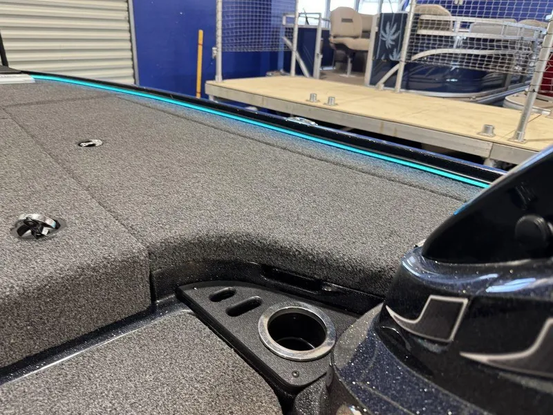 Slide: The Image of 2022 Nitro Z19 Pro boat deck with storage compartments and cup holder. - 12
