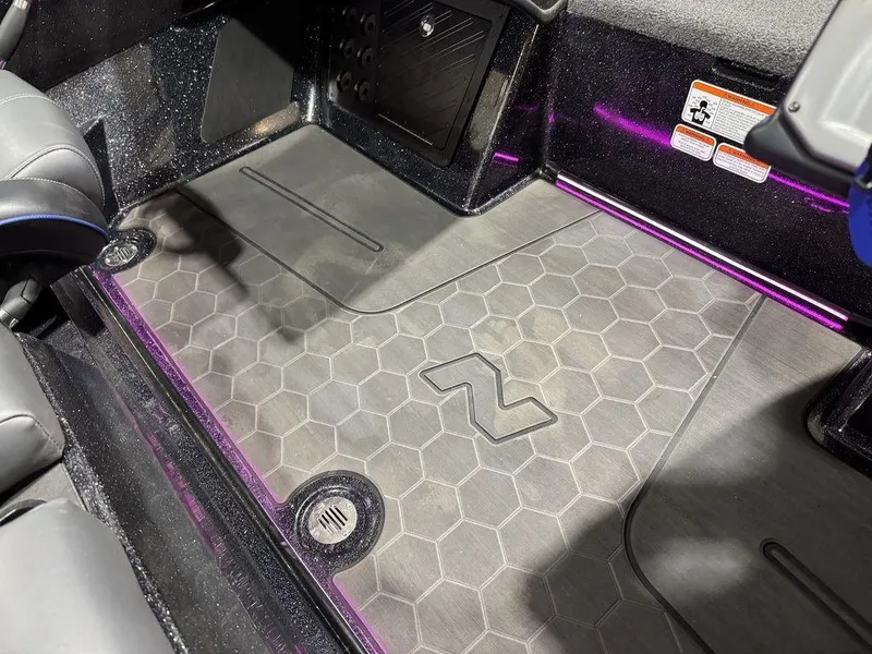 Slide: The Image of 2022 Nitro Z19 Pro boat interior with hexagonal floor design and purple accents. - 13