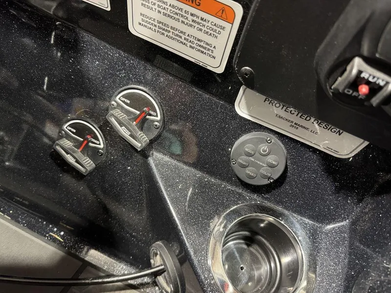 Slide: The Image of Control panel of a 2022 Nitro Z19 Pro boat with switches and dials. - 17