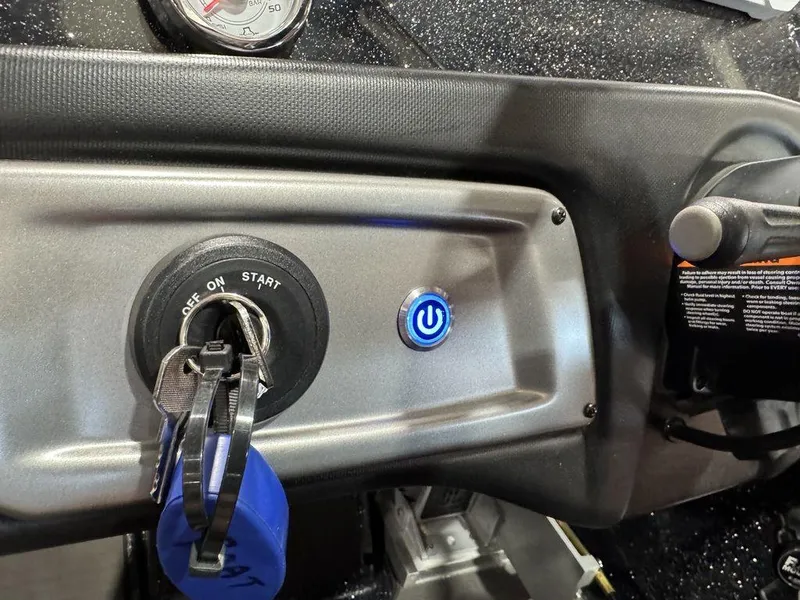 Slide: The Image of Dashboard of 2022 Nitro Z19 Pro boat with ignition key and power button. - 18