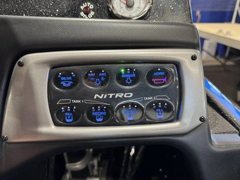Slide: The Image of Control panel of 2022 Nitro Z19 Pro boat with illuminated buttons and gauges. - 19