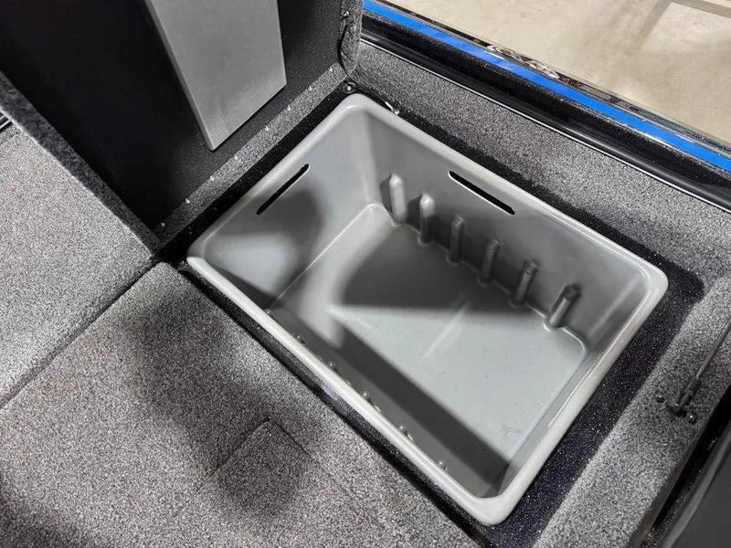 Slide: The Image of 2022 Nitro Z19 Pro storage compartment with gray interior and carpeted edges. - 23