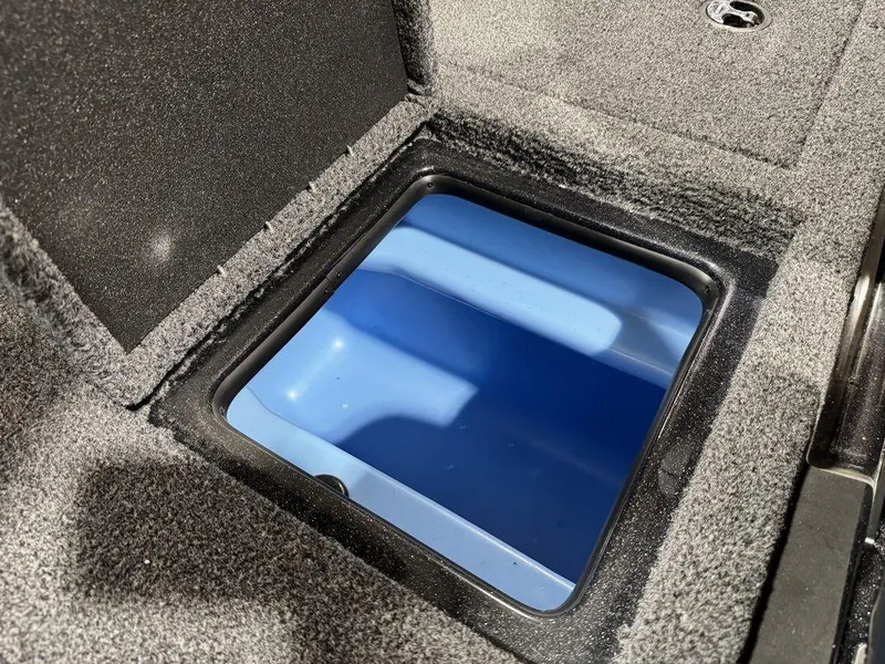 Slide: The Image of Storage compartment in 2022 Nitro Z19 Pro boat, featuring a blue interior. - 24