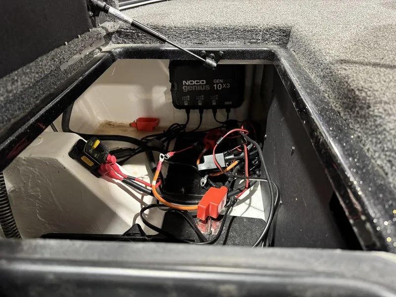 Slide: The Image of Interior view of a 2022 Nitro Z19 Pro showing wiring and a NOCO Genius charger. - 26