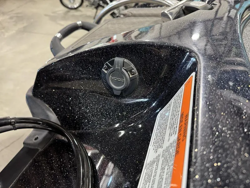 Slide: The Image of 2022 Nitro Z19 Pro boat dashboard with NOCO plug and warning label. - 27