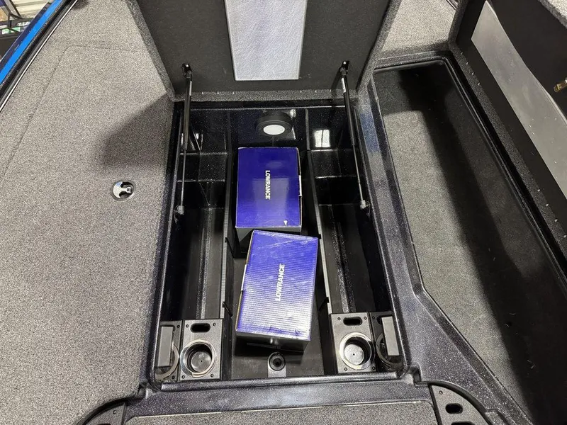 Slide: The Image of 2022 Nitro Z19 Pro storage compartment with two Lowrance boxes inside. - 32