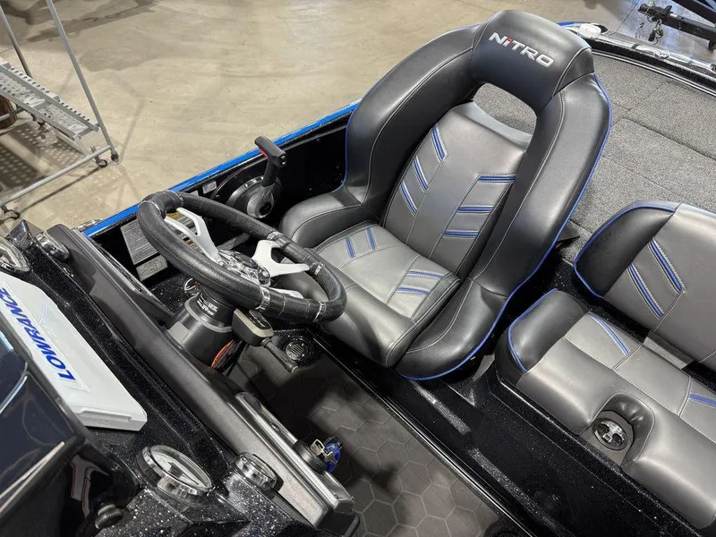 Slide: The Image of 2022 Nitro Z19 Pro boat interior with steering wheel and seats. - 39