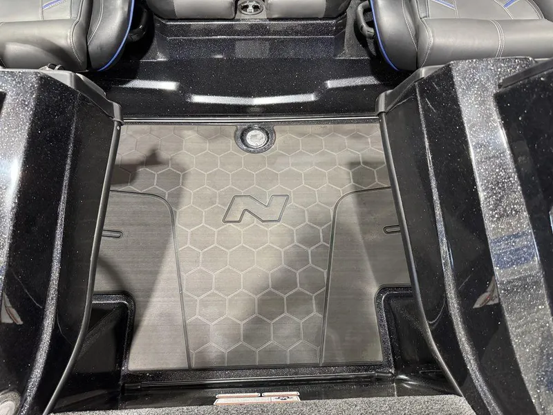 Slide: The Image of 2022 Nitro Z19 Pro boat interior with hexagonal pattern flooring and sleek black design. - 40