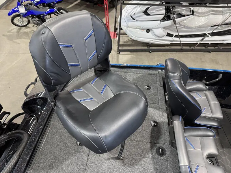 Slide: The Image of 2022 Nitro Z19 Pro boat seat with sleek black and blue design in showroom. - 47