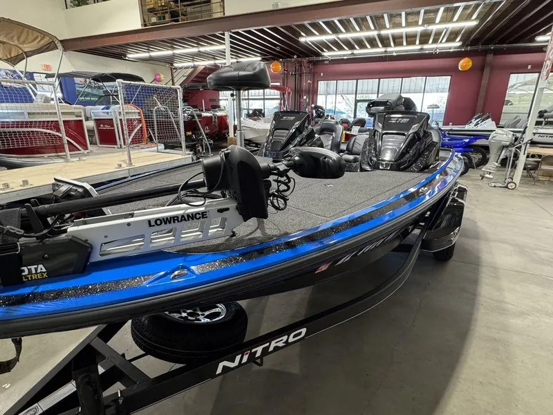 Slide: The Image of 2022 Nitro Z19 Pro bass boat in showroom with advanced fishing equipment. - 7