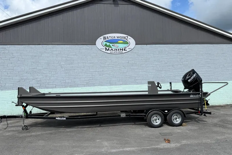 The Image of 2025 SeaArk 2472 Workhorse 240 boat on trailer, parked outside Water Workz Marine. - 8