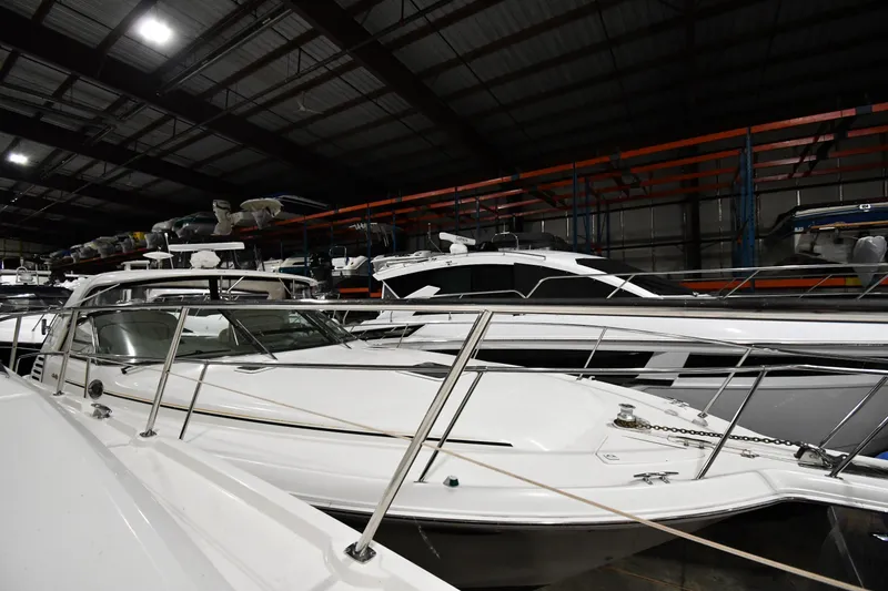 Slide: The Image of 2000 Sea Ray 370 Express Cruiser in indoor storage facility. - 1