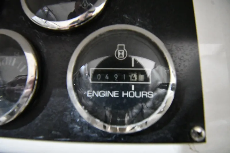 Slide: The Image of Engine hours gauge showing 491.5 hours on a 2000 Sea Ray 370 Express Cruiser. - 14