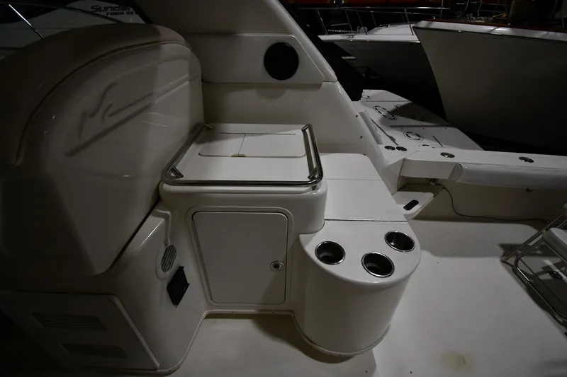 Slide: The Image of 2000 Sea Ray 370 Express Cruiser interior with seating and cup holders. - 20