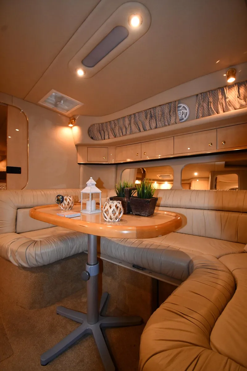 Slide: The Image of Interior of 2000 Sea Ray 370 Express Cruiser with elegant seating and decor. - 30