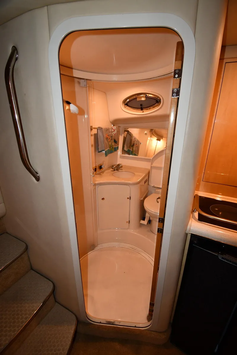 Slide: The Image of 2000 Sea Ray 370 Express Cruiser bathroom interior with shower and vanity. - 41