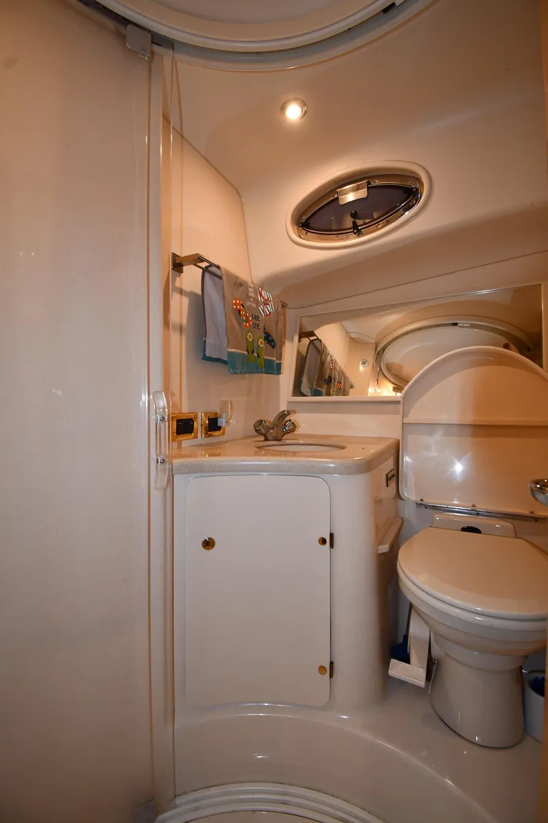 Slide: The Image of 2000 Sea Ray 370 Express Cruiser bathroom with compact design and modern amenities. - 42
