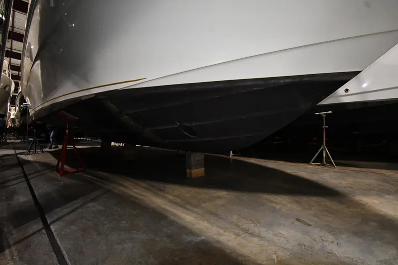 Slide: The Image of 2000 Sea Ray 370 Express Cruiser hull in dry dock, side view. - 44