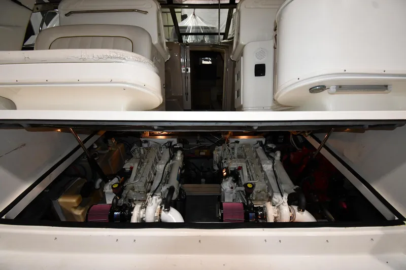 Slide: The Image of Engine compartment of 2000 Sea Ray 370 Express Cruiser with dual engines visible. - 47