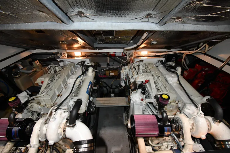 Slide: The Image of Engine room of a 2000 Sea Ray 370 Express Cruiser with dual engines. - 48