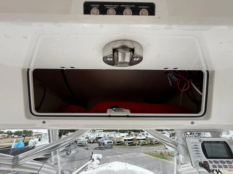 Slide: The Image of 2021 Sea Fox 228 Commander boat dashboard with storage compartment and control panel. - 34