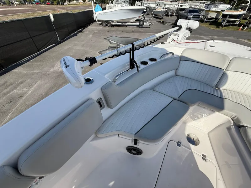 Slide: The Image of 2021 Sea Fox 228 Commander boat with cushioned seating and fishing rod holders. - 46