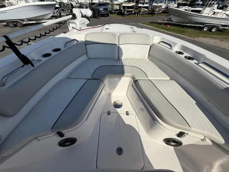 Slide: The Image of 2021 Sea Fox 228 Commander boat interior with cushioned seating and cup holders. - 49