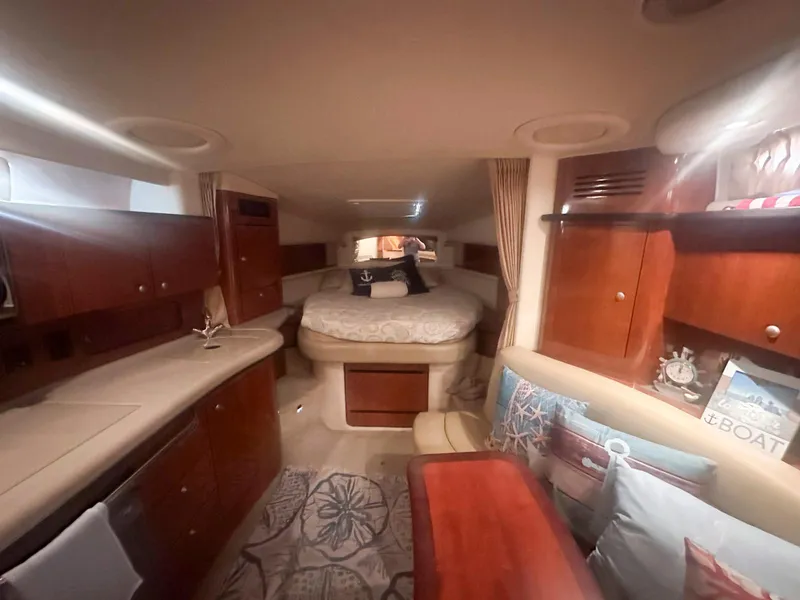 Slide: The Image of Luxurious interior of 2007 Sea Ray 320 Sundancer yacht with cozy bed and elegant wood finish. - 13
