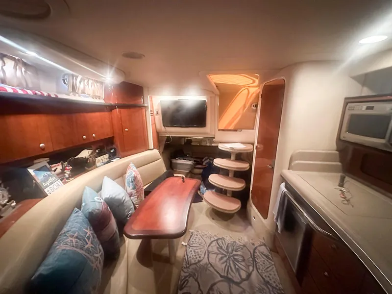 Slide: The Image of Interior of 2007 Sea Ray 320 Sundancer yacht with cozy seating and modern amenities. - 15