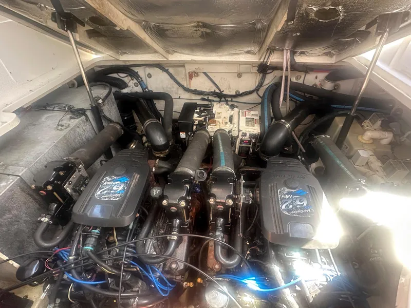 Slide: The Image of Engine compartment of a 2007 Sea Ray 320 Sundancer boat, showcasing dual engines. - 20