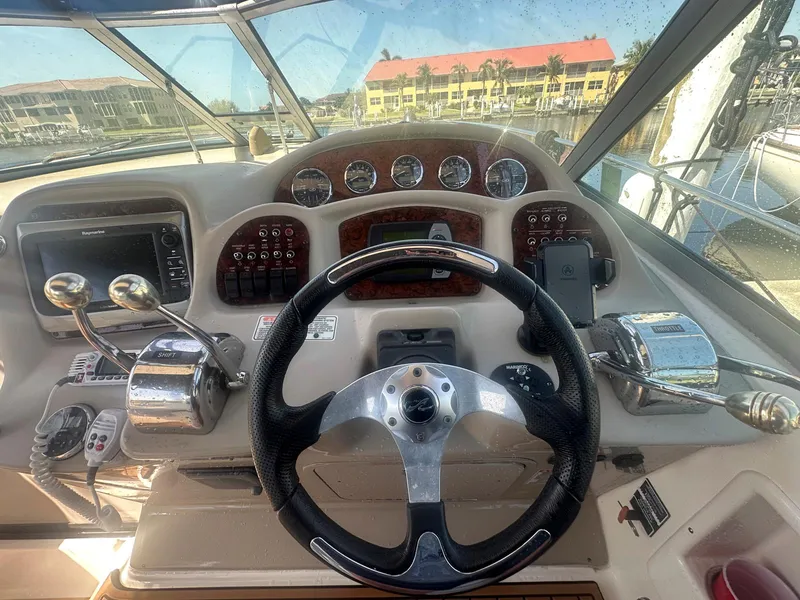 Slide: The Image of Helm of 2007 Sea Ray 320 Sundancer with steering wheel and control panel. - 5