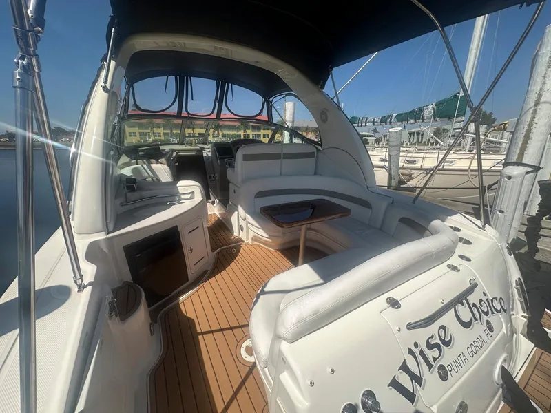 Slide: The Image of 2007 Sea Ray 320 Sundancer boat interior with seating and wood flooring. - 9