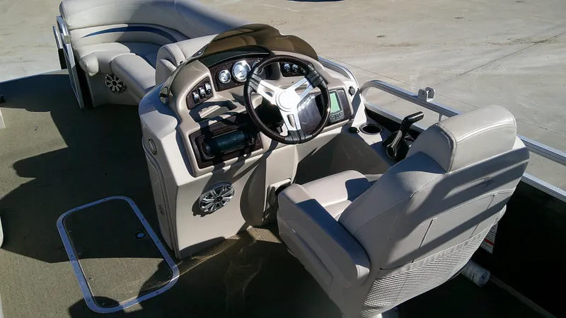 Slide: The Image of 2015 Bennington G 22 boat interior with steering console and seating. - 6