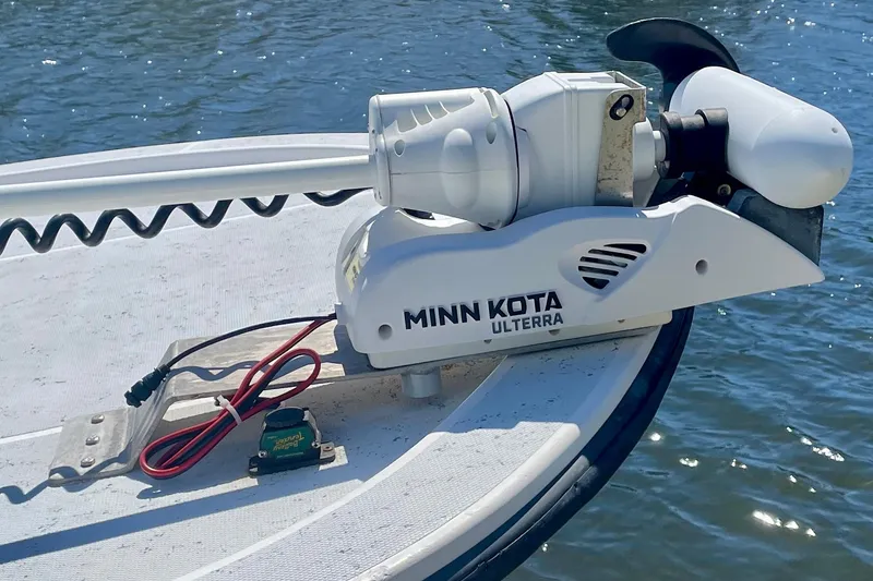 Slide: The Image of Minn Kota Ulterra trolling motor on 2016 Shallow Sport 18 Sport boat, on water. - 10