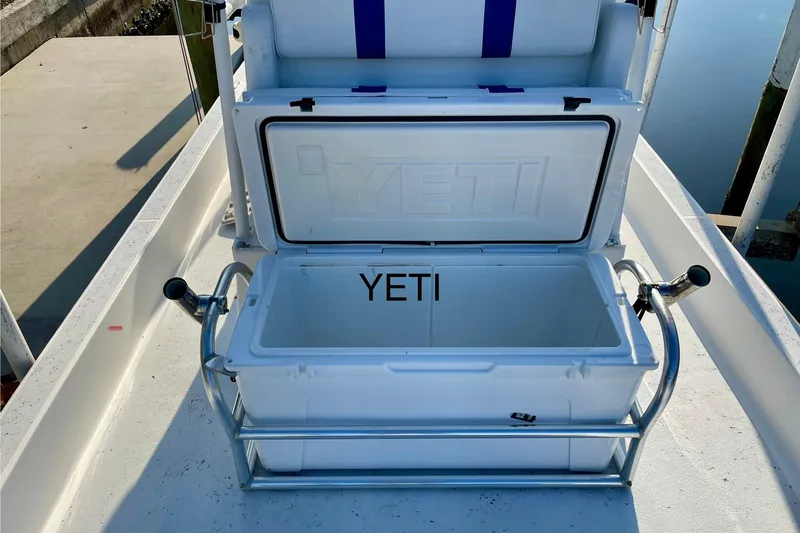 Slide: The Image of Open YETI cooler on 2016 Shallow Sport 18 Sport boat deck. - 22