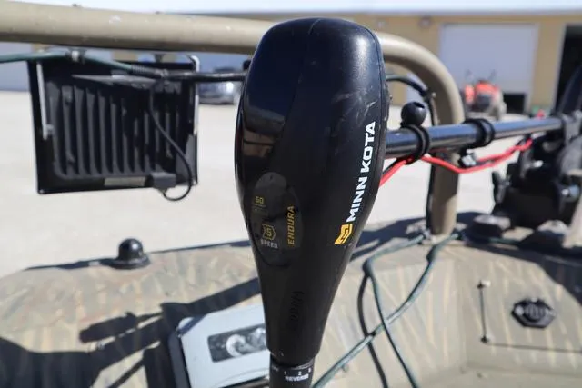 Slide: The Image of Minn Kota motor on 2016 Tracker Grizzly 1860 MVX boat, close-up view. - 14