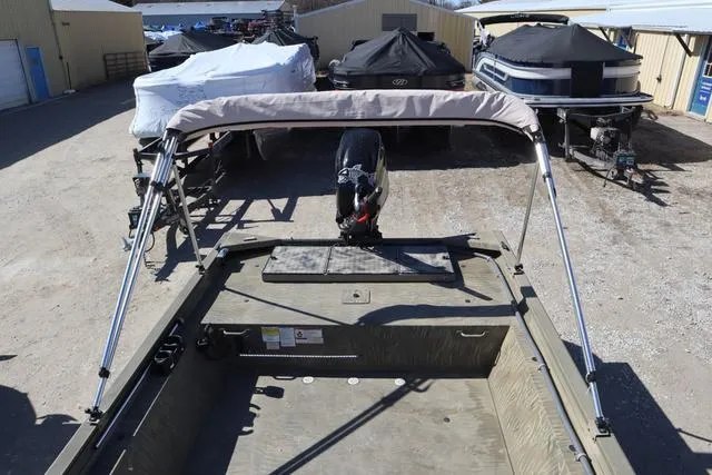 Slide: The Image of 2016 Tracker Grizzly 1860 MVX boat with canopy in storage yard. - 15