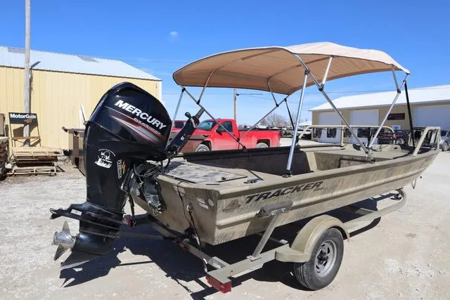 Slide: The Image of 2016 Tracker Grizzly 1860 MVX boat with Mercury outboard motor and canopy on trailer. - 19