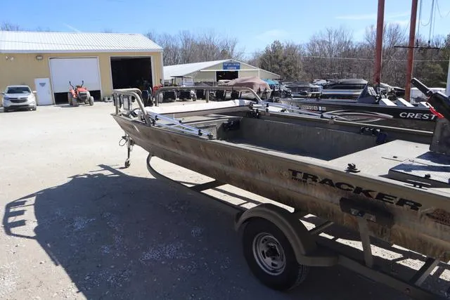 Slide: The Image of 2016 Tracker Grizzly 1860 MVX boat on trailer in outdoor storage area. - 3