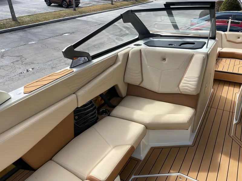 Slide: The Image of 2025 Nautique Super Air Nautique G25 interior with beige seating and sleek design. - 10