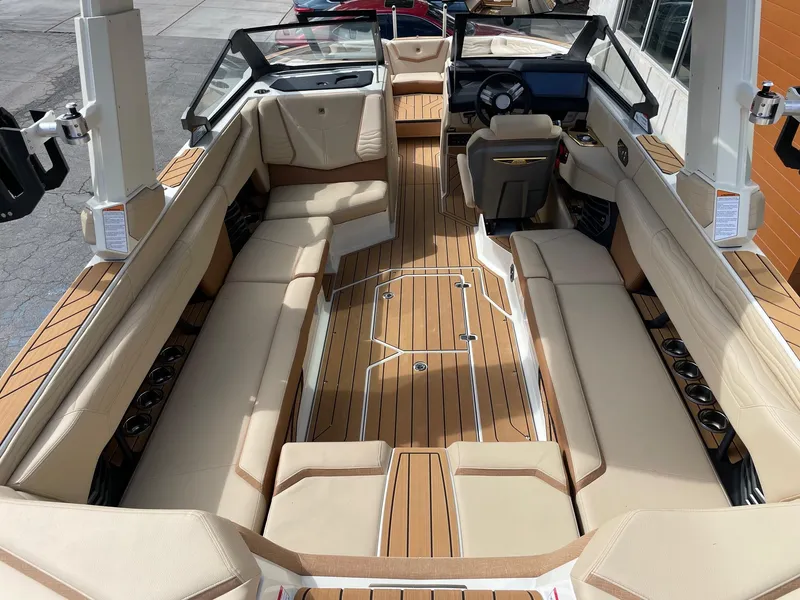 Slide: The Image of 2025 Nautique Super Air Nautique G25 interior with luxurious seating and modern design. - 5