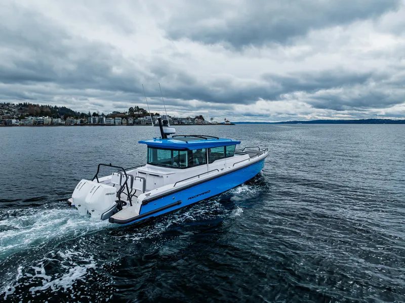 Slide: The Image of 2021 Axopar 37xc Wetbar cruising on a cloudy day in open water. - 20